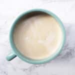 Pumpkin Spice Coffee in a light blue mug on a marble backdrop