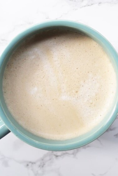 Pumpkin Spice Coffee in a light blue mug on a marble backdrop