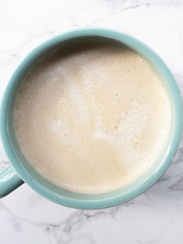 Pumpkin Spice Coffee in a light blue mug on a marble backdrop