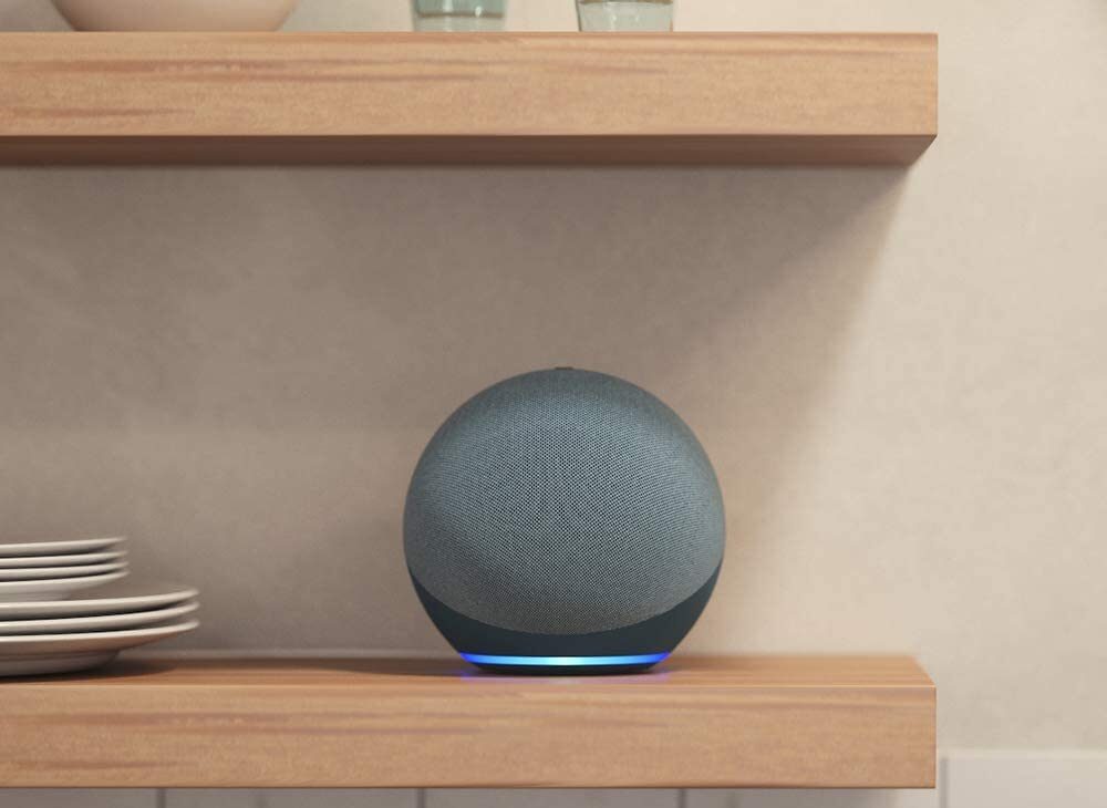 Amazon Echo Smart Assistant on wooden shelf with plates on left