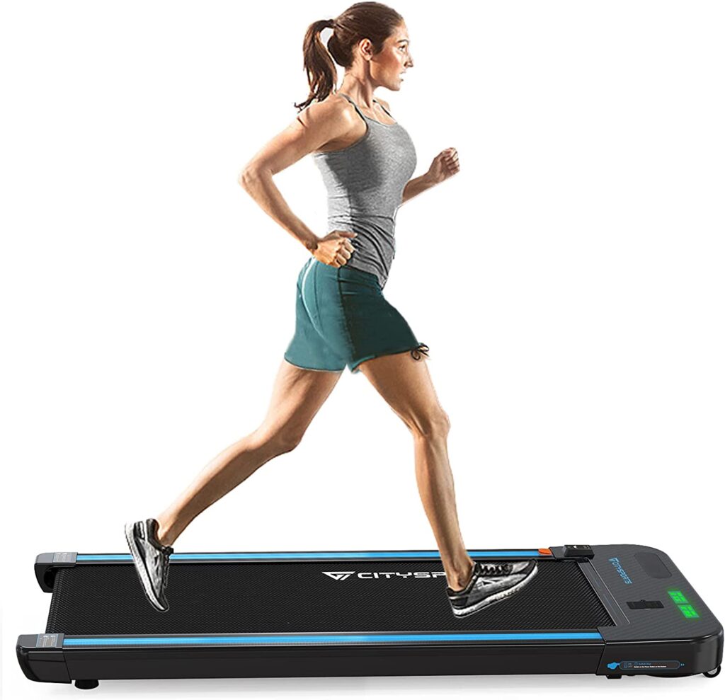Female running on desk treadmill