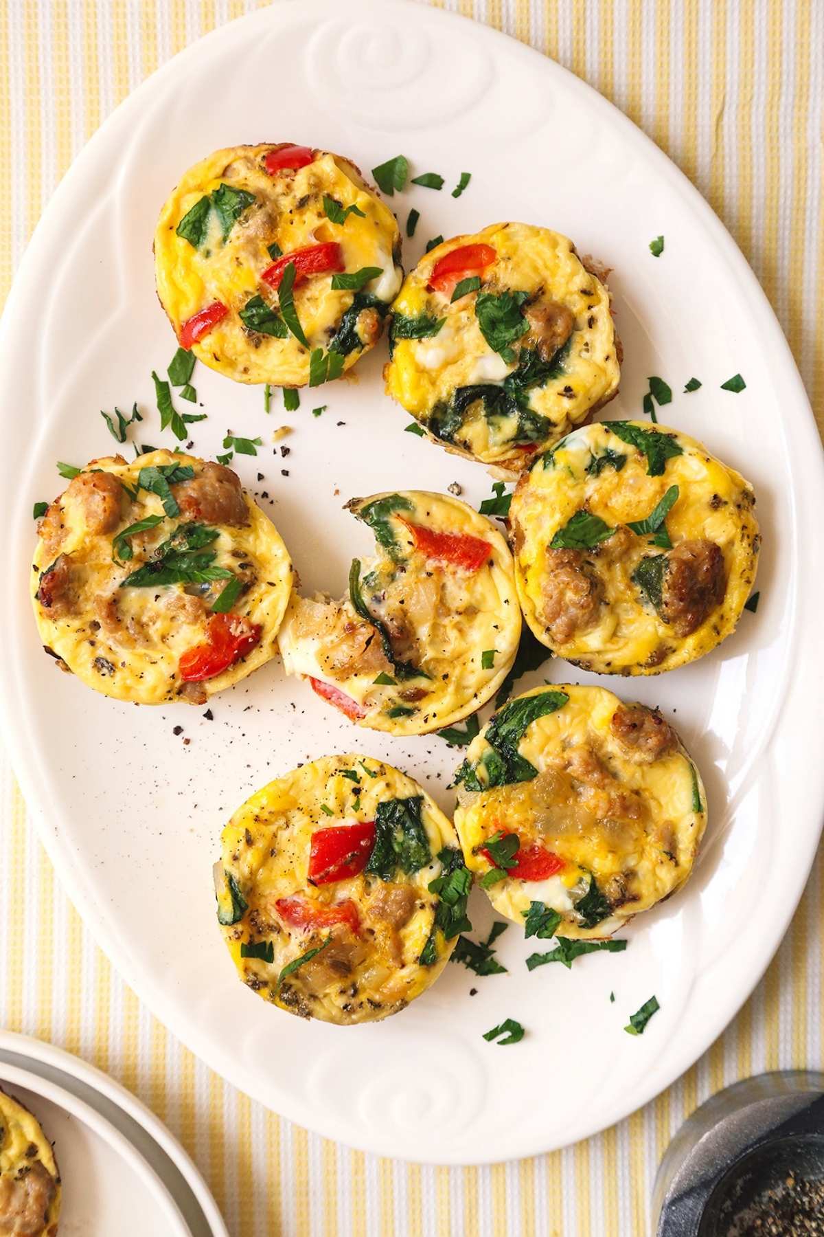 Overhead image of dairy-free egg muffins on a white plate.